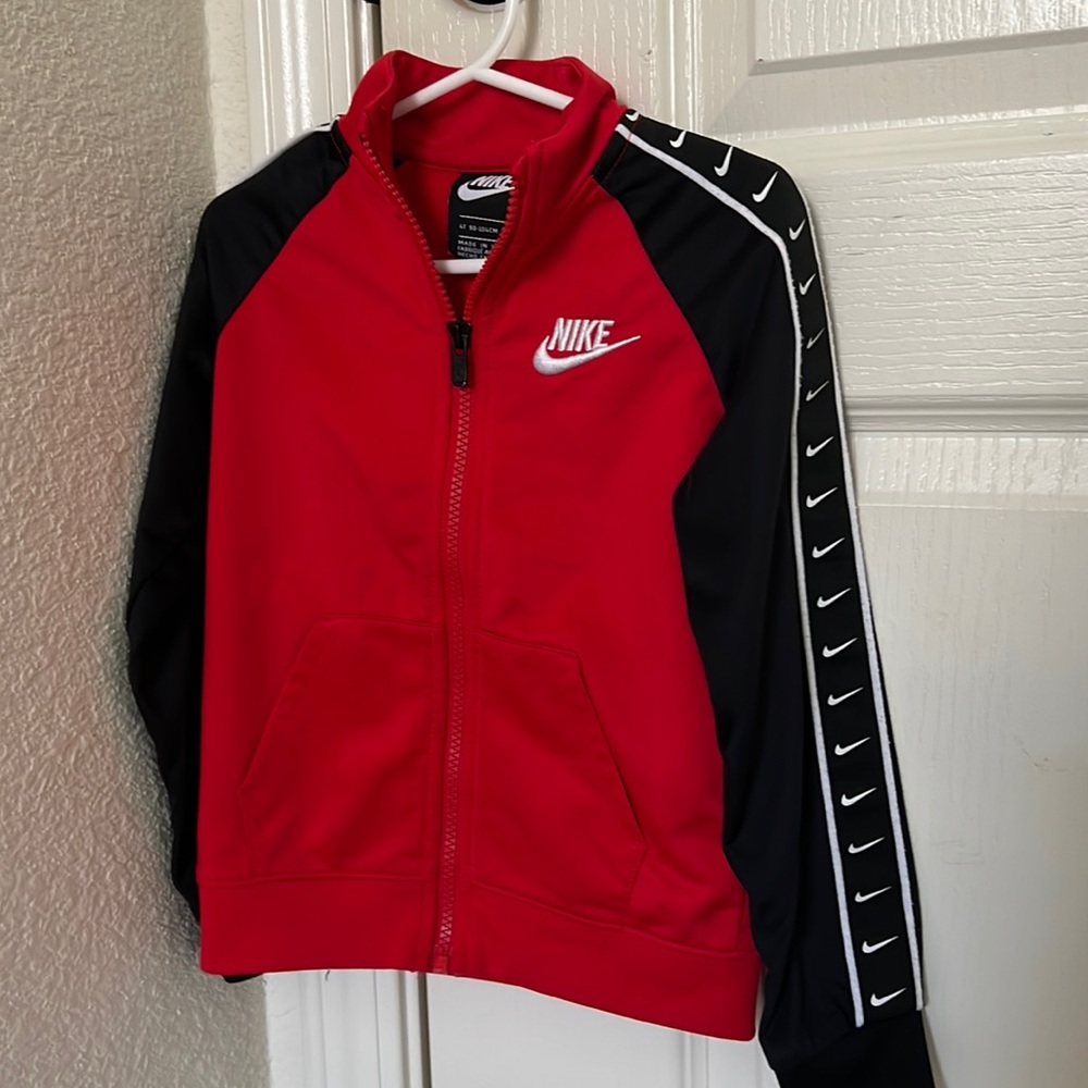 A red and black Nike tracksuit set
